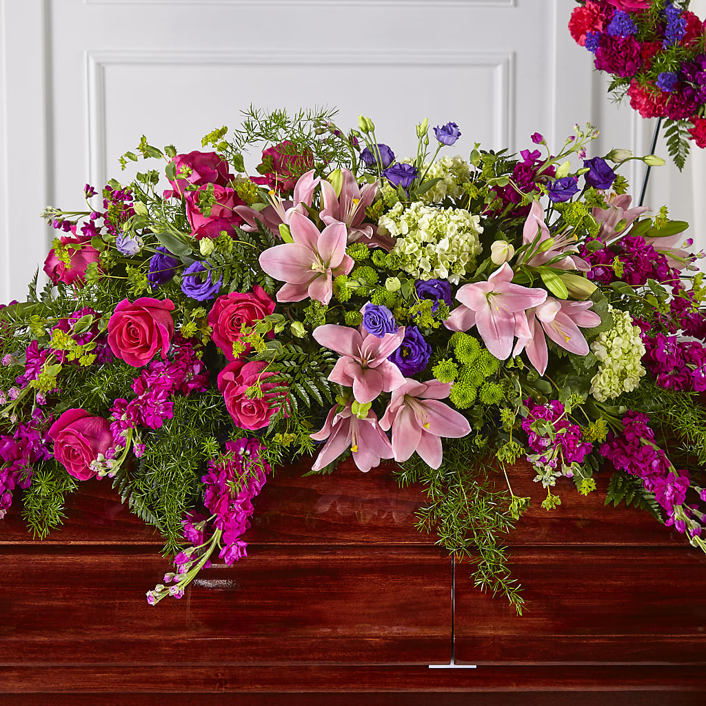 Radiant Tribute Casket Spray – Hurst Florist, Callahan FL