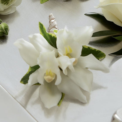 White Mini Cymbidium Boutonniere –  Hurst Florist, Callahan FL